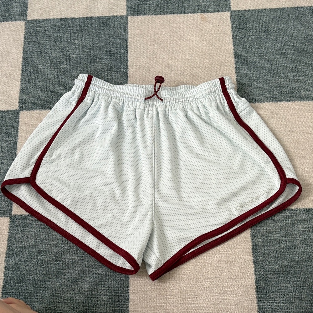 Outdoor Voices blue Athletic Shorts with marroon Trim